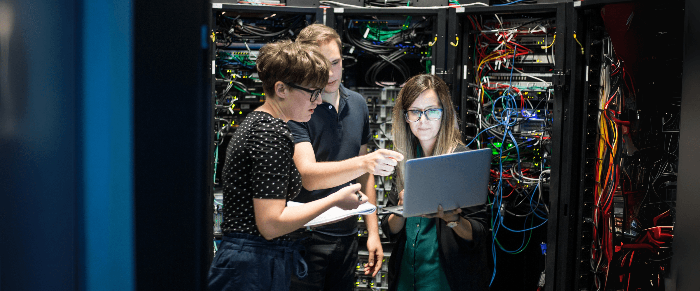 IT team working in a network room.